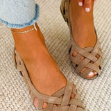 Open-toe flat sandals with woven straps